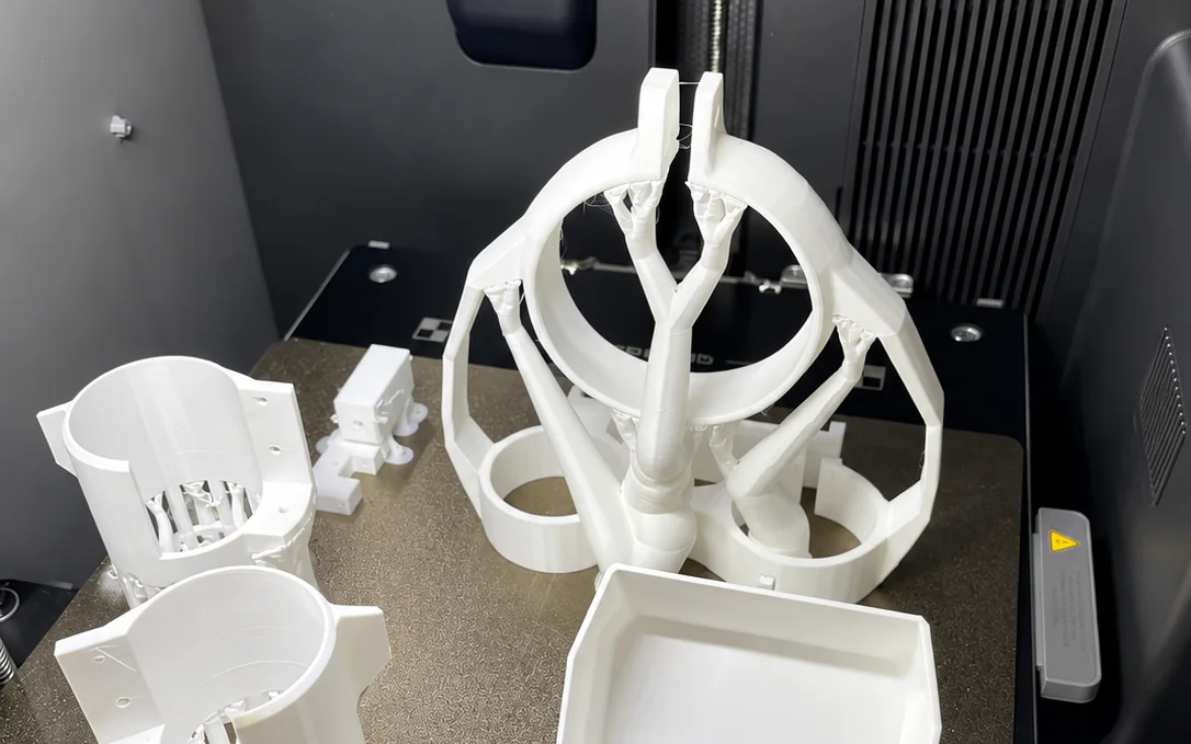 Freshly printed 3D-printed parts on a printer build plate