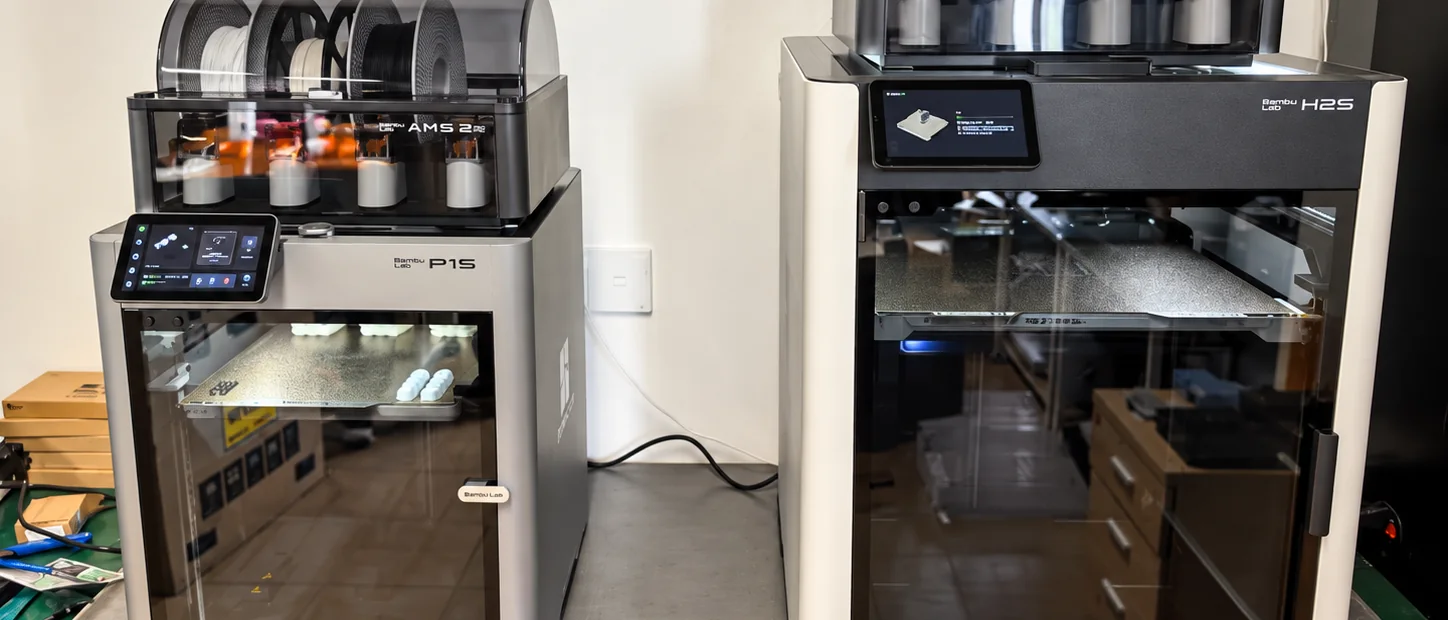 Workshop shelves with enclosed 3D printers and material storage